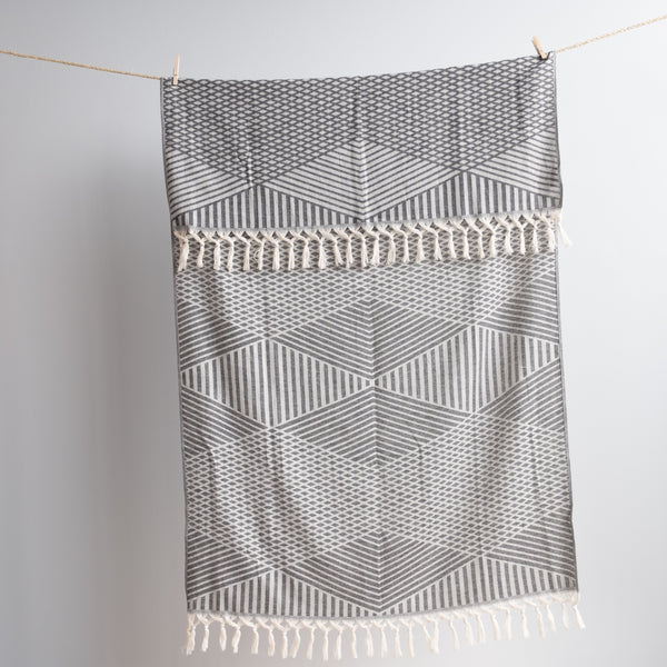 Hanging grey Aphrodite Turkish bath and beach towel on the rope Urban Pera